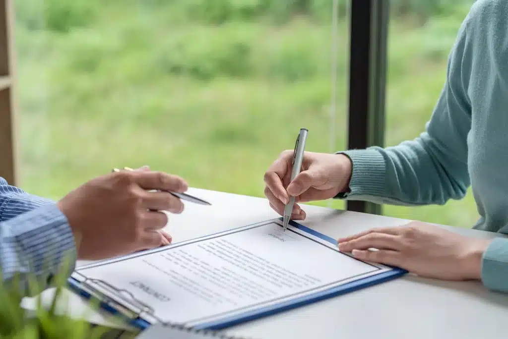 Employee signing employment contract